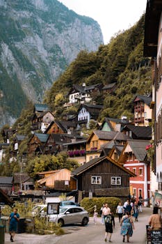 Scenic view of Hallstatt, Austria, showcasing charming architecture nestled against a lush mountainside.